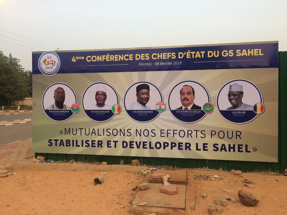 A billboard in Niamey, Niger, announcing a summit of Heads of State, including Chadian President Idriss Déby (first from right), of the G5-Sahel regional security forum, February 2018. [Photo via Wikimedia Commons]