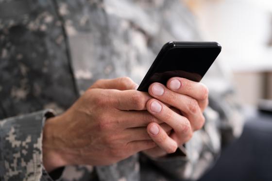40286864-social-cyber-warfare-army-soldier-using-phone.jpg