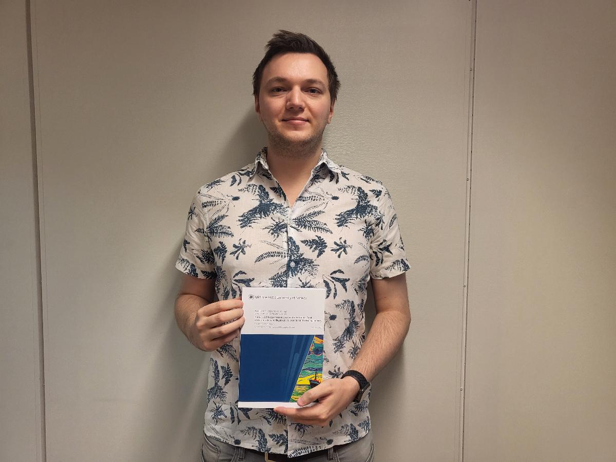 Tor-Arne Schmidt Nordmo with his Ph.D. Thesis titled "Dutkat: A Privacy-Preserving System for Automatic Catch Documentation and Illegal Activity in the Fishing Industry".