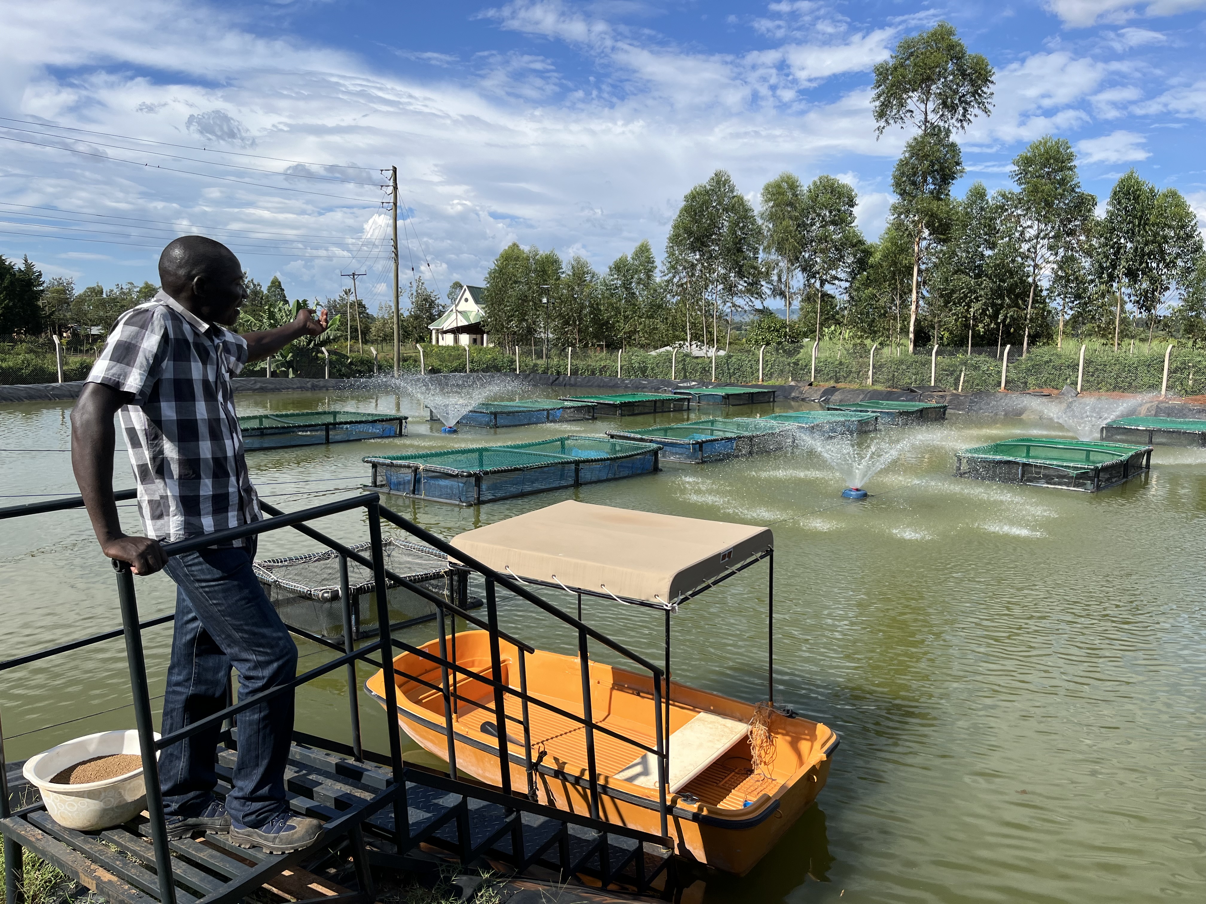 man at a fish farm in Africa