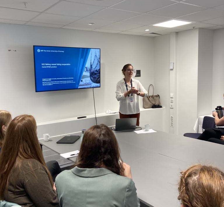 Eva van der Marel giving a presentation in front of an audience