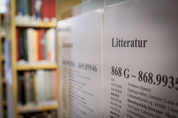 Book shelves with poster of literature classifications