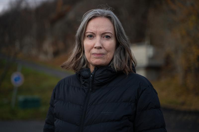 Woman with dark winter coat.