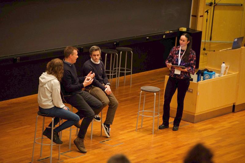 Four people on a stage.