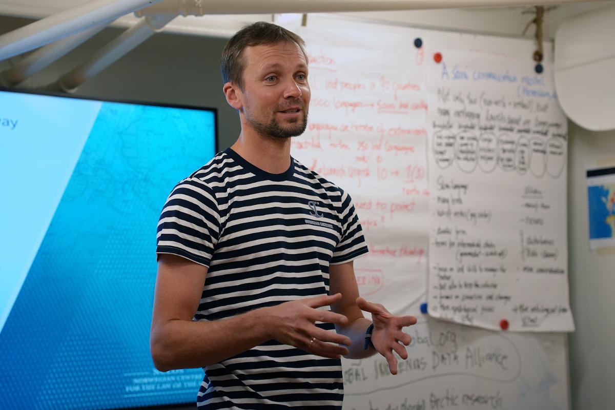 A person standing talking.