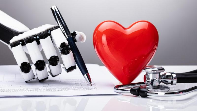 heart next to robotic hand