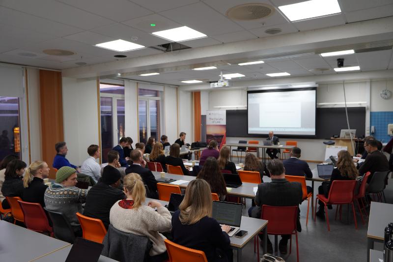 The group is listening to the seminar